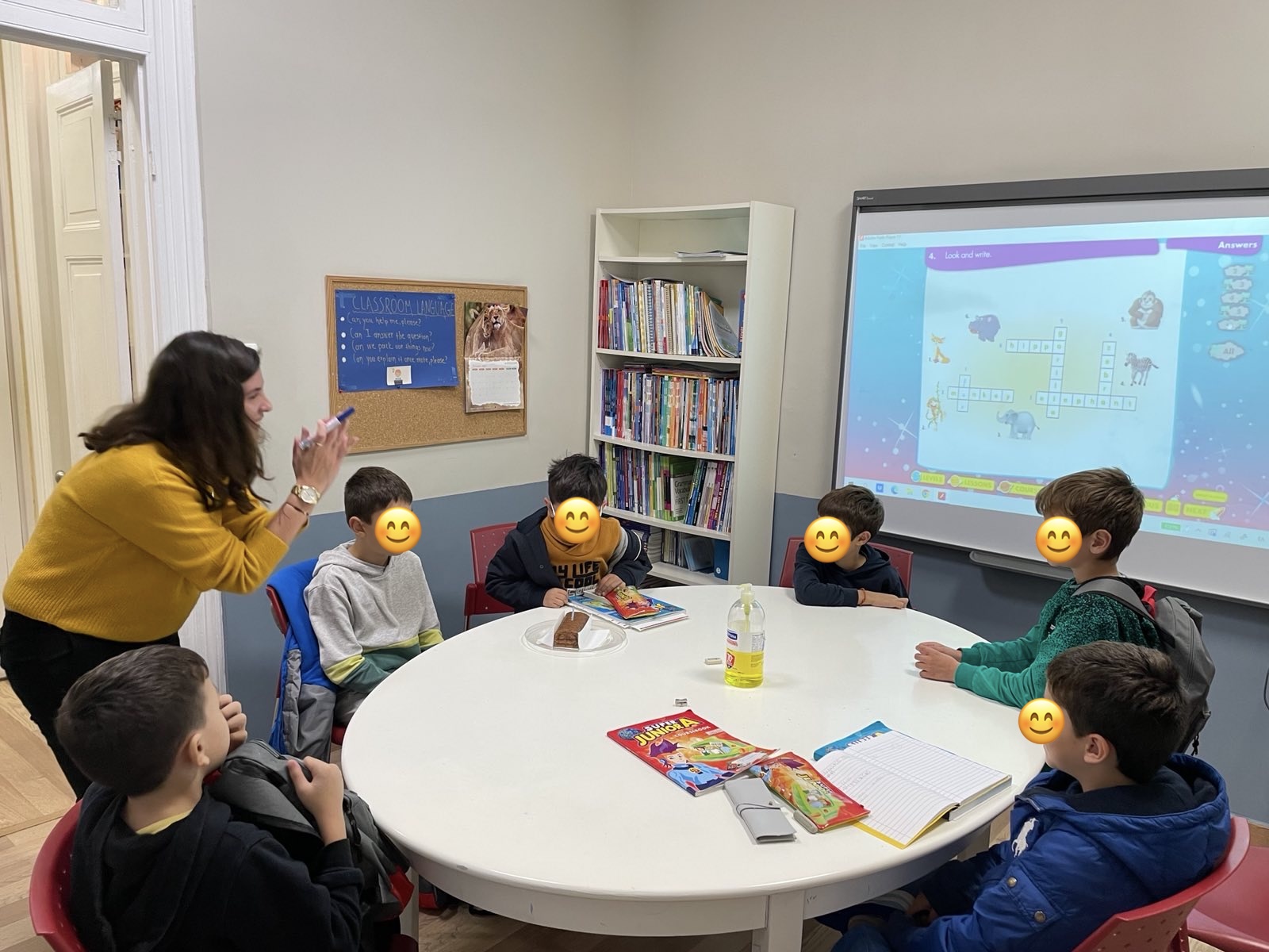 A junior Greek class mid-lesson around the classroom table